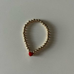 Alexa Leigh heart bracelet one side red one side blue.